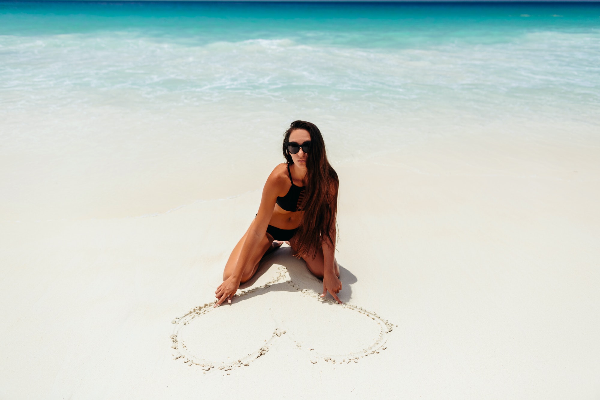 woman on beach vacation in tropics